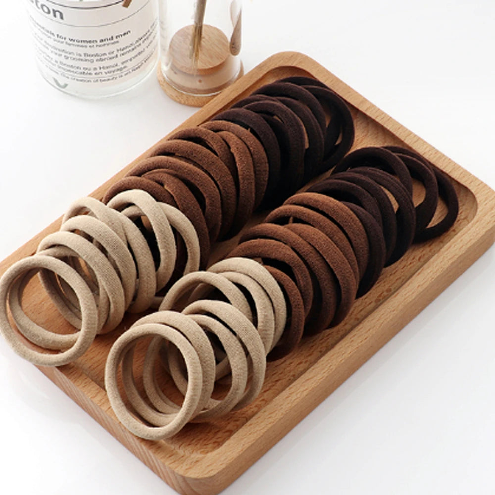 50/100 pcs Elastic Hair Bands – Strong & No-Damage Hair Ties (Black)