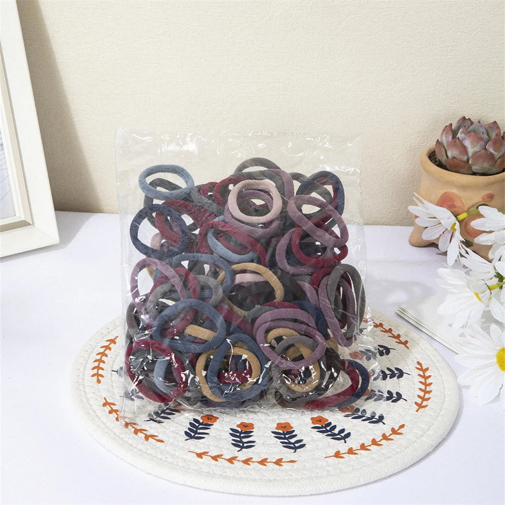 50/100 pcs Elastic Hair Bands – Strong & No-Damage Hair Ties (Black)